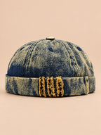 Denim-Dockermütze Bocca mit Leoparden-Patchwork – Farbvariante Gelb, Ansicht von vorn