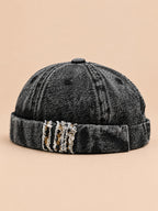 Denim-Dockermütze Bocca mit Leoparden-Patchwork – Farbvariante Schwarz, Dreiviertelansicht