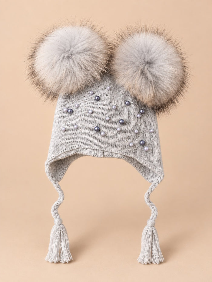 Deux pompons amovibles