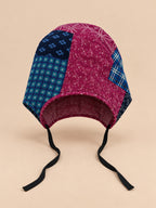 Damen-Turbanmütze aus Patchworkstoff mit zweifarbigem, blumenförmigem Knoten, Modell 2, Vorderansicht