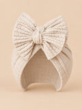 Baby-Turbanmütze für Mädchen aus Baumwollstrick mit Knoten – Hellbeige, Vorderansicht