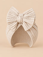 Baby-Turbanmütze für Mädchen aus Baumwollstrick mit Knoten – Hellbeige, Vorderansicht